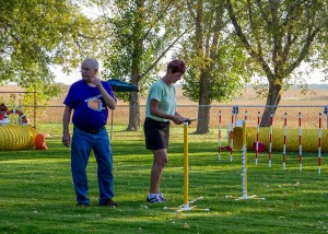 Judge Brigitte tweeks her course with able bodied assistant, Glenn.  Photo by Joan Morgan