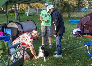 Pierre enjoys some puppy-love with Nicole & her Mom looking on.  Photo by Joan Morgan